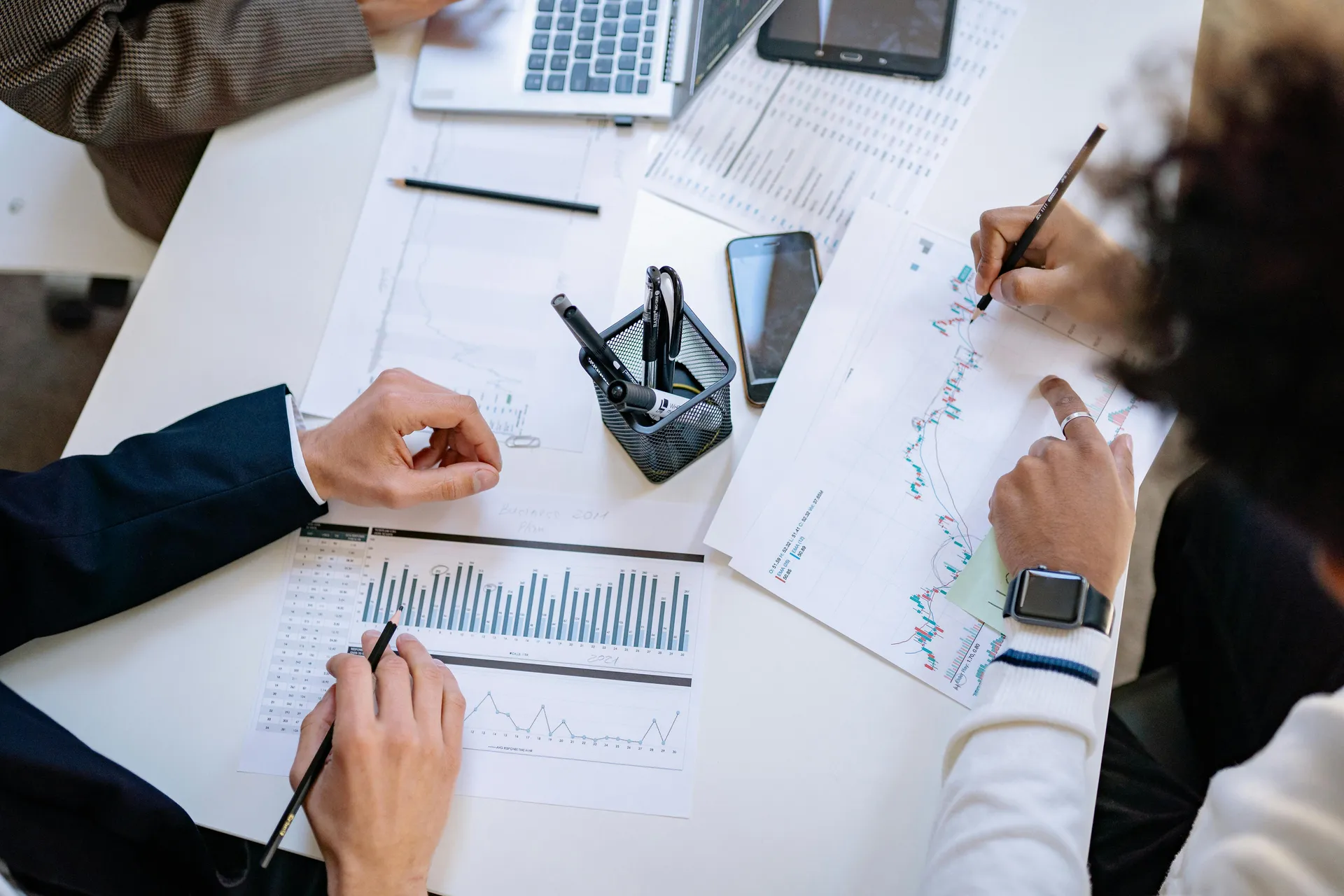 Financial advisors analysing charts and data